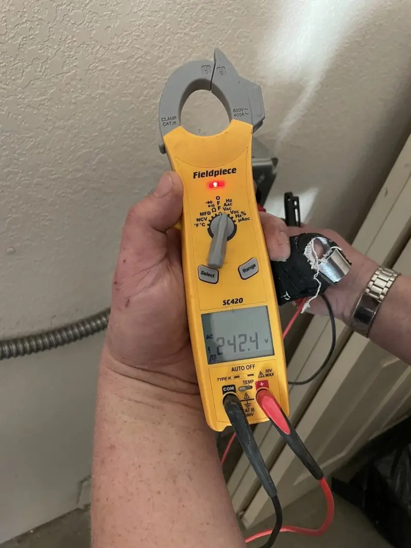 Voltage testing with clamp meter during Electrical Installation Services in Ocala